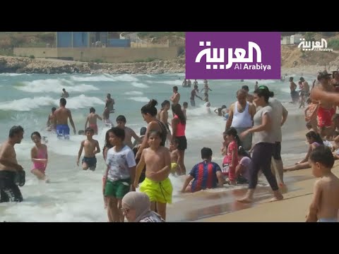 شاهد سباحة رغم المياه العادمة في لبنان