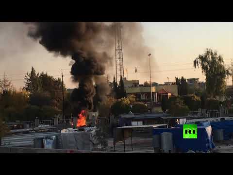 محتجون يضرمون النار في مكاتب أحزاب في السليمانية العراقية